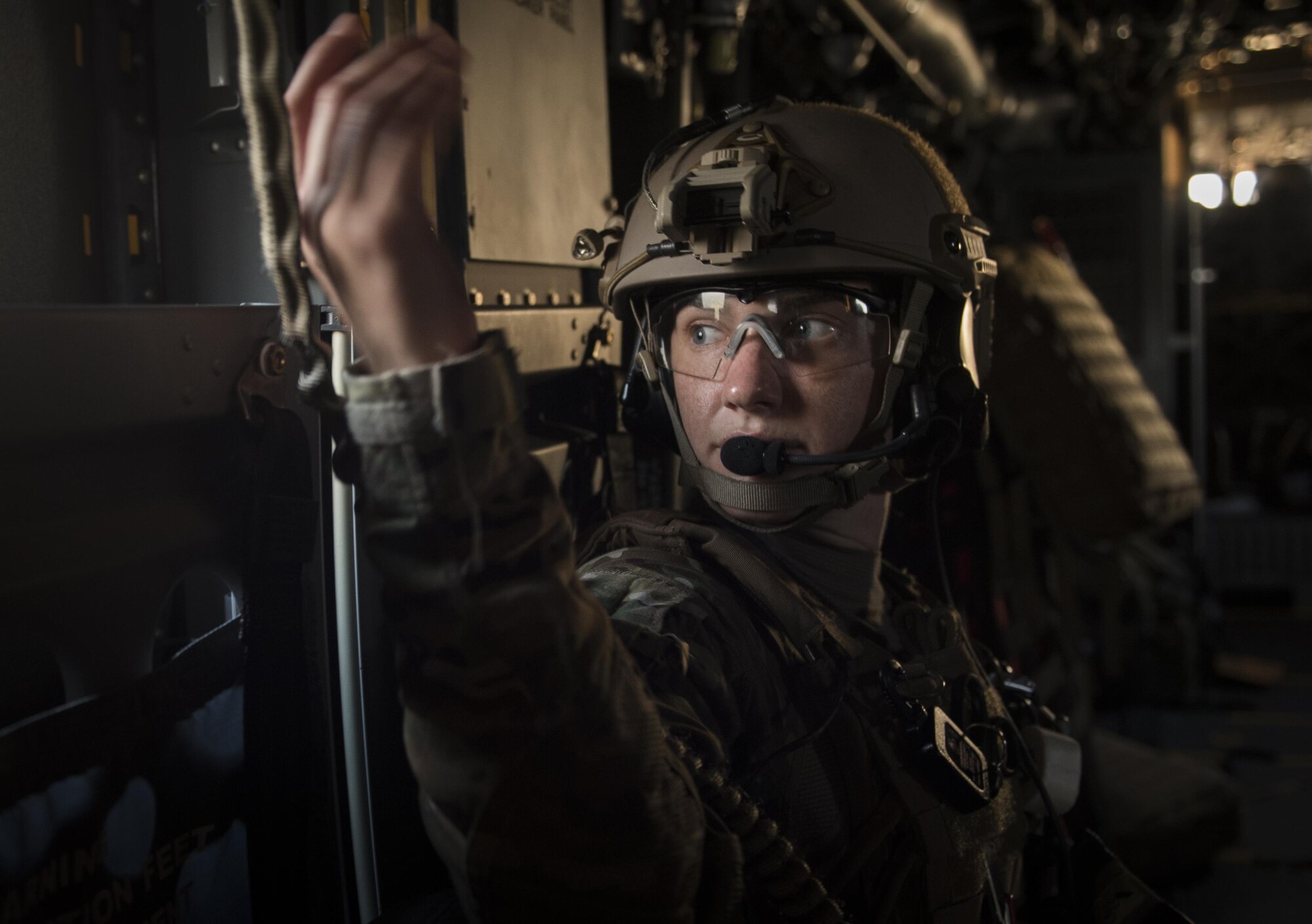Capt. Casey Fox, a flight physician assistant with the 1st Special Operations Medical Group, looks out a window on-board a CV-22 Osprey during Task Force Exercise Olympus Archer at Wright Patterson Air Force Base, Ohio, Aug. 18, 2016. Olympus Archer focuses on maximizing training opportunities for more than 230 Air Commandos, with the 1st Special Operations Wing, emphasizing on medical operations in conjunction with flying operations. (U.S. Air Force photo by Staff Sgt. Christopher Callaway)