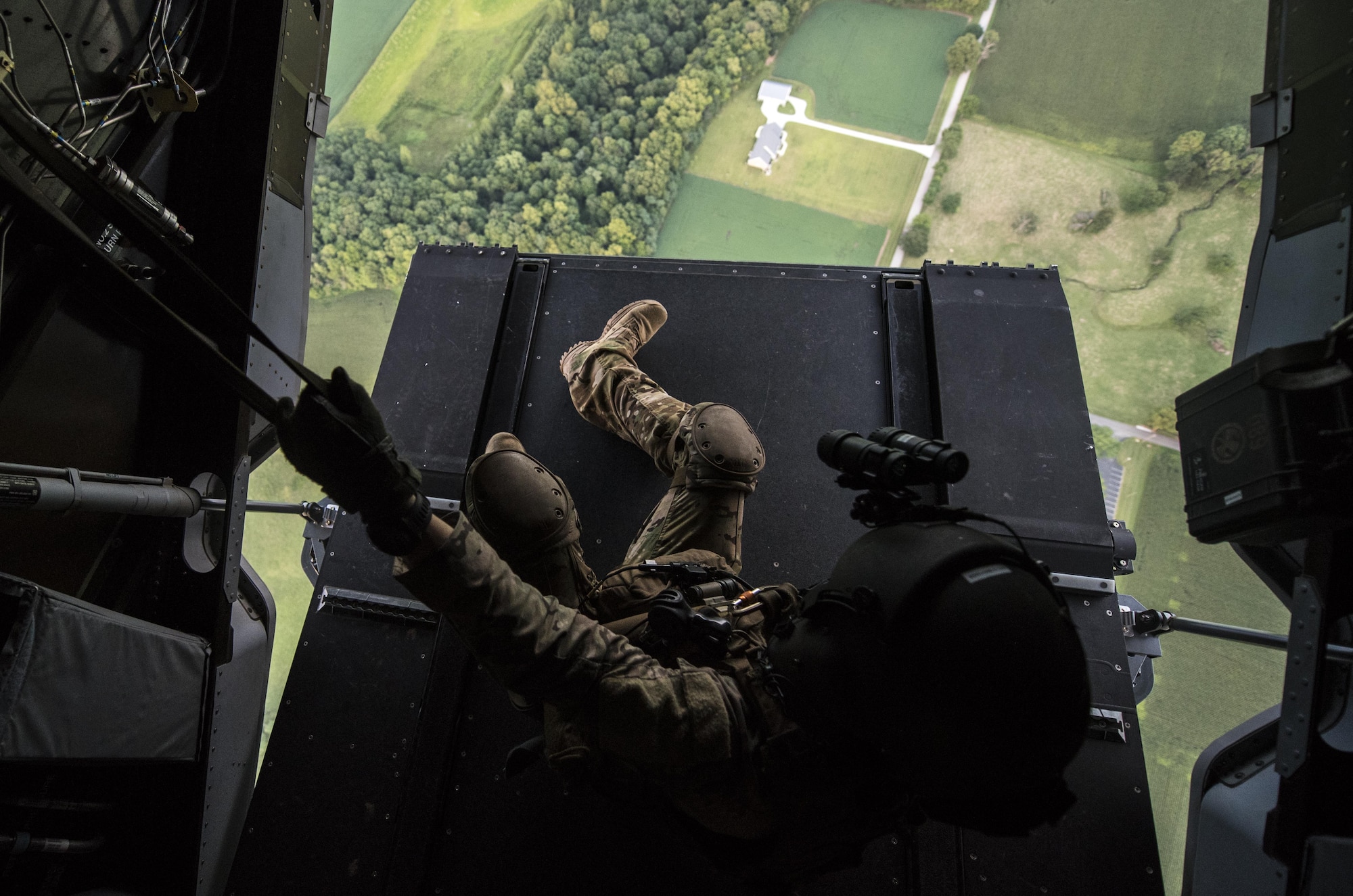 Staff Sgt. Zachary Brummell, a CV-22 flight engineer with the 8th Special Operations Squadron, scans for threats during Task Force Exercise Olympus Archer at Wright Patterson Air Force Base, Ohio, Aug. 18, 2016. Olympus Archer focuses on maximizing training opportunities for more than 230 Air Commandos, with the 1st Special Operations Wing, emphasizing on medical operations in conjunction with flying operations. (U.S. Air Force photo by Staff Sgt. Christopher Callaway)