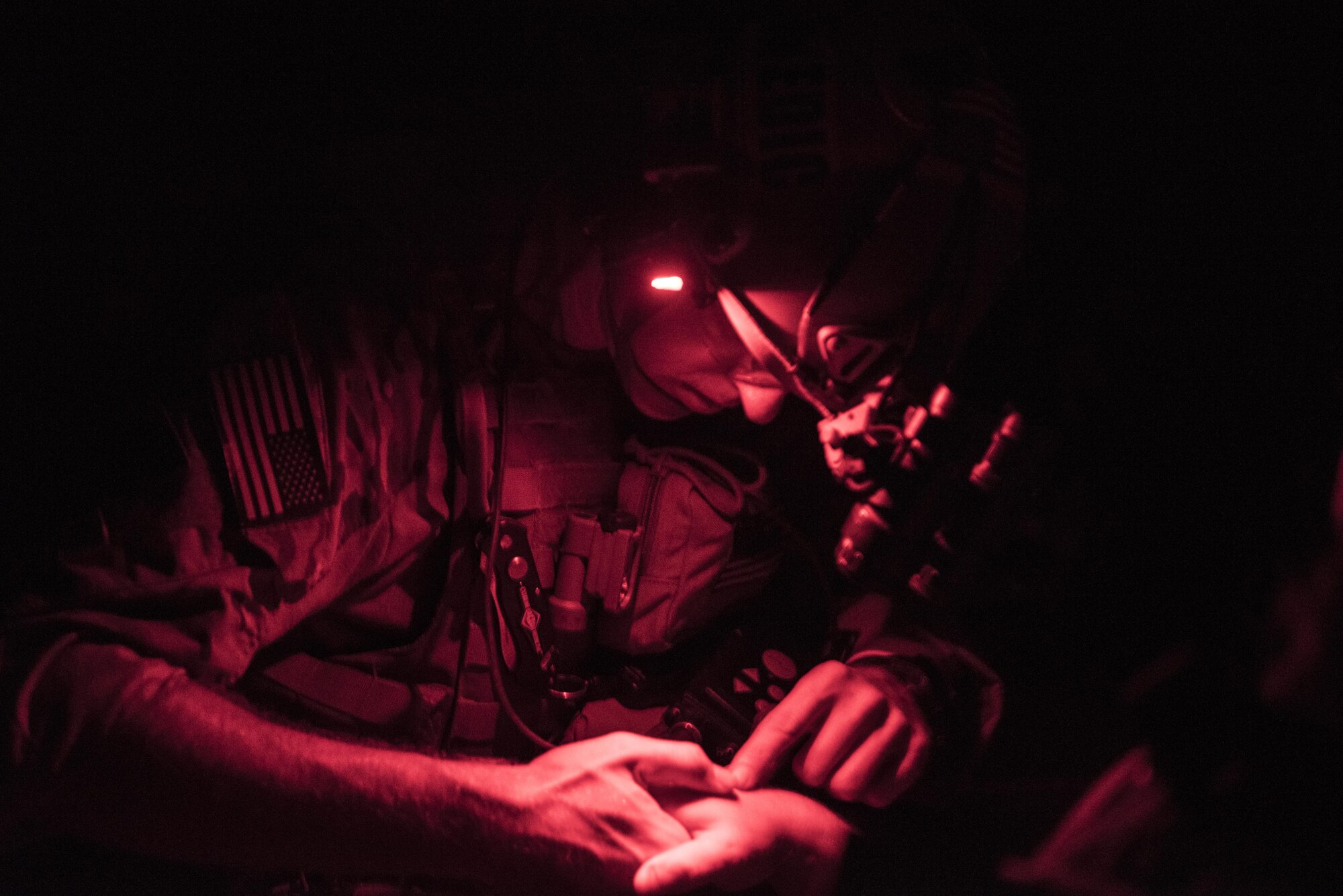 Capt. Aaron Thomas, a flight surgeon with the 1st Special Operations Medical Group, examines a patient’s arm during Task Force Exercise Olympus Archer at Wright Patterson Air Force Base, Ohio, Aug. 18, 2016. Olympus Archer focuses on maximizing training opportunities for more than 230 Air Commandos, with the 1st Special Operations Wing, emphasizing on medical operations in conjunction with flying operations. (U.S. Air Force photo by Staff Sgt. Christopher Callaway)