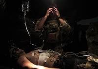 Capt. Aaron Thomas, a flight surgeon with the 1st Special Operations Medical Group, wipes sweat off his forehead during Task Force Exercise Olympus Archer at Wright Patterson Air Force Base, Ohio, Aug. 18, 2016. Olympus Archer focuses on maximizing training opportunities for more than 230 Air Commandos, with the 1st Special Operations Wing, emphasizing on medical operations in conjunction with flying operations. (U.S. Air Force photo by Staff Sgt. Christopher Callaway)
