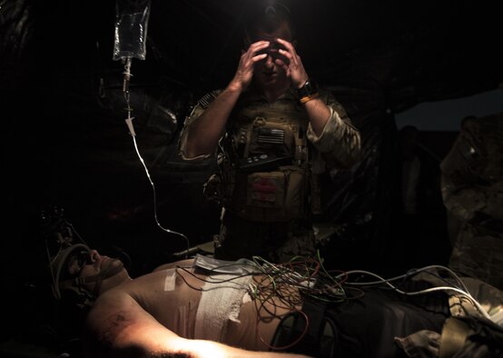Capt. Aaron Thomas, a flight surgeon with the 1st Special Operations Medical Group, wipes sweat off his forehead during Task Force Exercise Olympus Archer at Wright Patterson Air Force Base, Ohio, Aug. 18, 2016. Olympus Archer focuses on maximizing training opportunities for more than 230 Air Commandos, with the 1st Special Operations Wing, emphasizing on medical operations in conjunction with flying operations. (U.S. Air Force photo by Staff Sgt. Christopher Callaway)