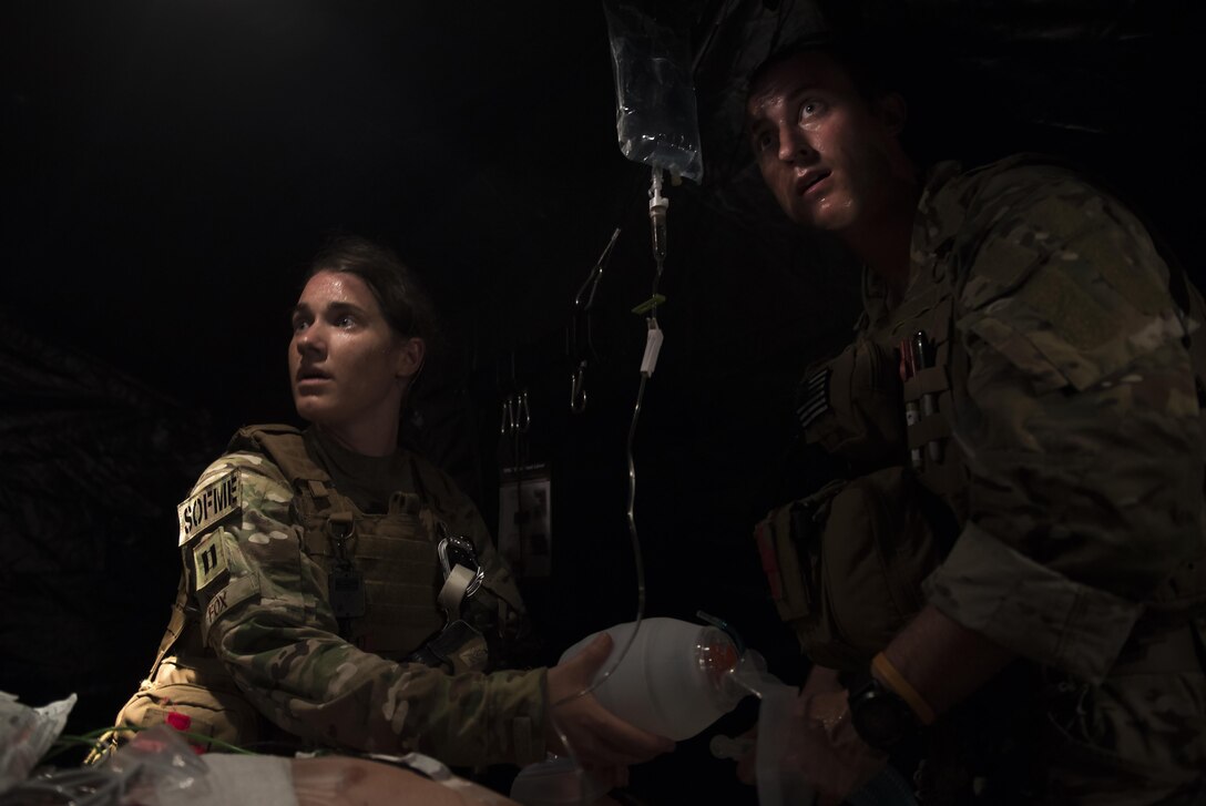 Capt. Casey Fox, a flight physician assistant with the 1st Special Operations Medical Group, left, and Capt. Aaron Thomas, a flight surgeon with the 1st SOMDG, provide medical care to a patient during Task Force Exercise Olympus Archer at Wright Patterson Air Force Base, Ohio, Aug. 18, 2016. Olympus Archer focuses on maximizing training opportunities for more than 230 Air Commandos, with the 1st Special Operations Wing, emphasizing on medical operations in conjunction with flying operations. (U.S. Air Force photo by Staff Sgt. Christopher Callaway)
