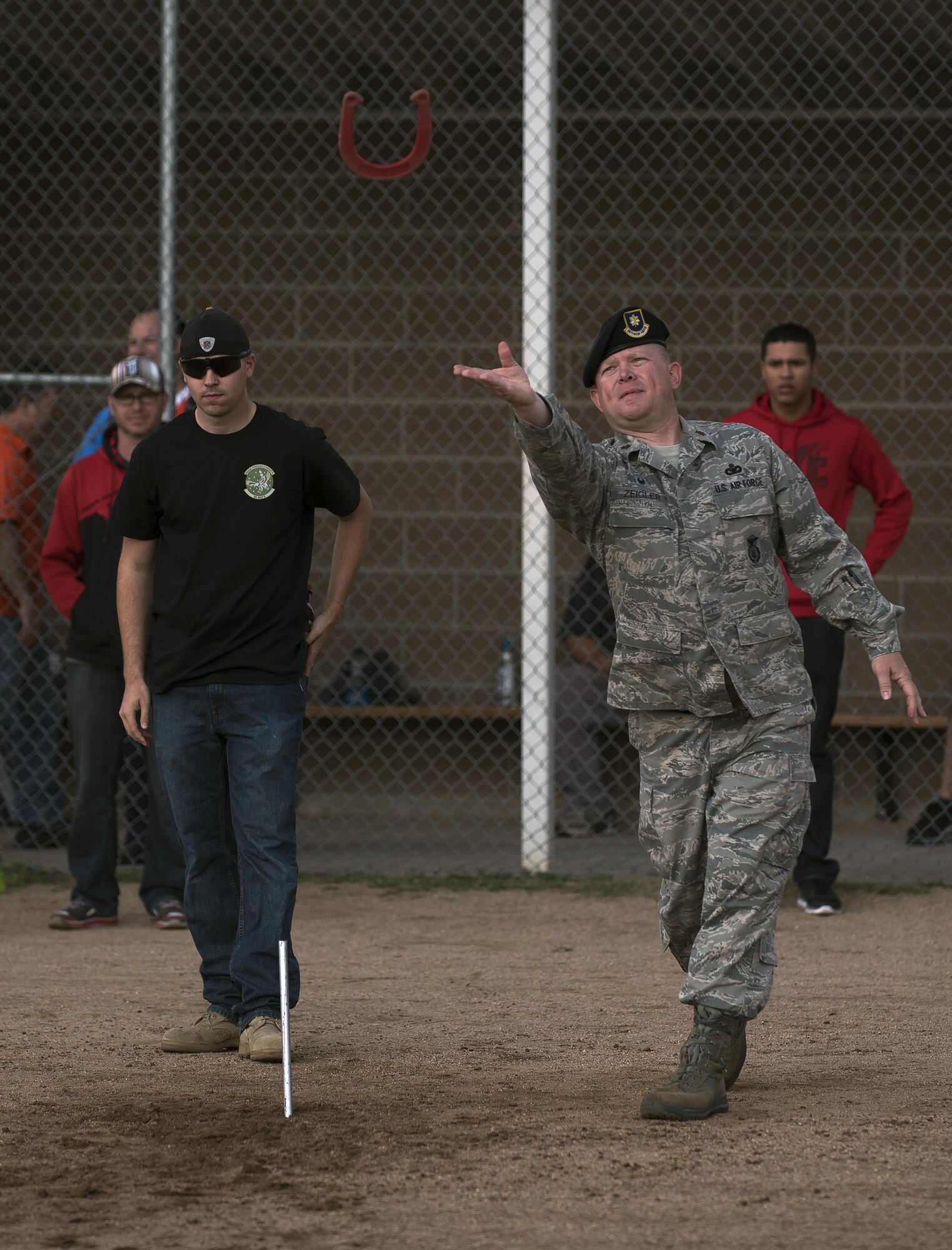 Maj. Richard Ziegler, 90th Security Forces Squadron commander, tosses a horseshoe during the annual Frontiercade competition at F.E. Warren Air Force Base, Wyo., Aug. 19, 2016. The horseshoe competition was one of 10 competitions that Airmen and their families competed in. (U.S. Air Force photo by Senior Airman Brandon Valle)