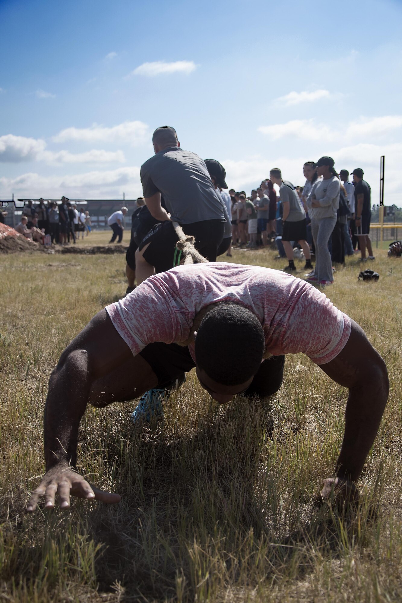 Akeem Ferguson anchors the 90th Security Support Squadron tug-o-war team during the annual Frontiercade competition at F.E. Warren Air Force Base, Wyo., Aug. 19, 2016. The team won the event, helping them secure the small unit championship award. (U.S. Air Force photo by Senior Airman Brandon Valle)