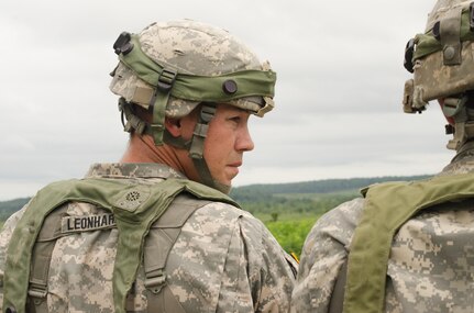 CAMP ATTERBURY, Ind. – Staff Sgt. Randall Leonhardt assigned to
2nd Battalion, 151st Infantry Regiment (Indiana National Guard) fire support leads his squad through live fire drills at Camp Atterbury, Indiana. The live fire exercise was a part of the annual National Guard readiness training known as the Exportable Combat Training Capability, which provides intense training to units without the expense of travel to a federal Combined Training Center. (Photo by SGT Raymond Maldonado, 206th Broadcast Operations Detachment)