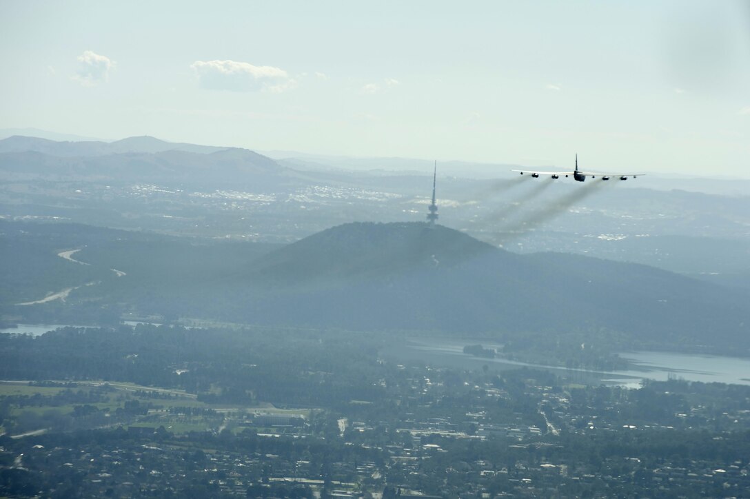 A U.S. Air Force B-52H Stratofortress returning from deployment at Andersen Air Force Base, Guam, flies over the 50th Anniversary of the Battle of Long Tan and Vietnam Remembrance Day ceremony at Canberra, Australia, Aug. 18, 2016. At the request of the Australian government, two Pacific Air Forces B-52s already scheduled to fly a training mission in support of exercise Pitch Black, supported the event commemorating the U.S. and Australia's strong alliance during the Vietnam War that continues to this day. (U.S. Air Force photo by Staff Sgt. Sandra Welch)
