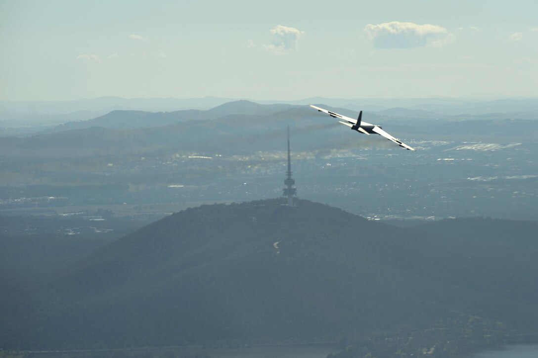 A U.S. Air Force B-52H Stratofortress returning from deployment at Andersen Air Force Base, Guam, flies over the 50th Anniversary of the Battle of Long Tan and Vietnam Remembrance Day ceremony at Canberra, Australia, Aug. 18, 2016. At the request of the Australian government, two Pacific Air Forces B-52s already scheduled to fly a training mission in support of exercise Pitch Black, supported the event commemorating the U.S. and Australia's strong alliance during the Vietnam War that continues to this day. (U.S. Air Force photo by Staff Sgt. Sandra Welch)