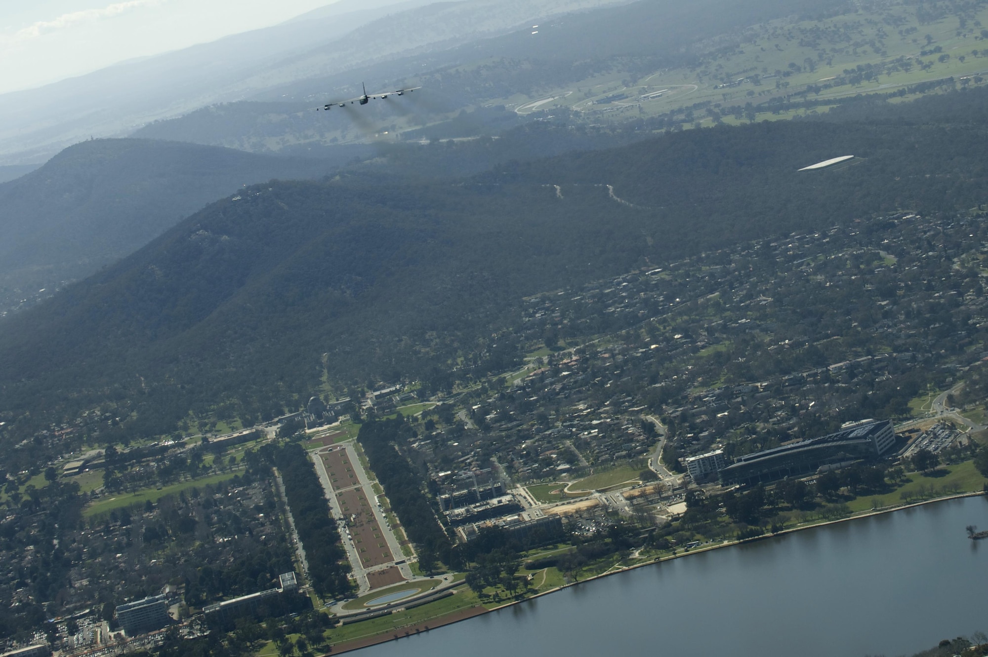 A U.S. Air Force B-52H Stratofortress returning from deployment at Andersen Air Force Base, Guam, flies over the 50th Anniversary of the Battle of Long Tan and Vietnam Remembrance Day ceremony at Canberra, Australia, Aug. 18, 2016. At the request of the Australian government, two Pacific Air Forces B-52s already scheduled to fly a training mission in support of exercise Pitch Black, supported the event commemorating the U.S. and Australia's strong alliance during the Vietnam War that continues to this day. (U.S. Air Force photo by Staff Sgt. Sandra Welch)