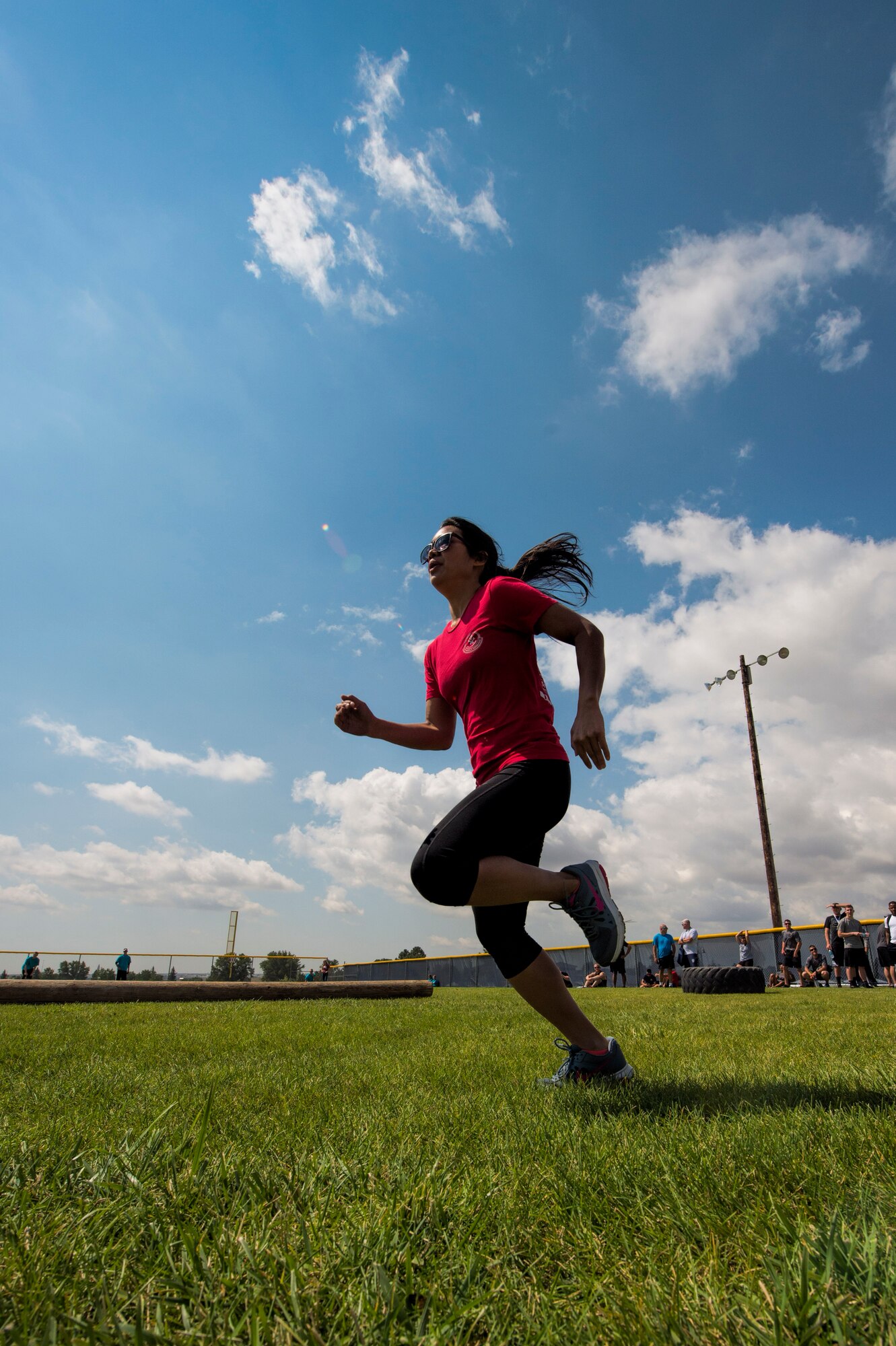 Allia Martinez, 320th Missile Squadron missileer, runs the last obstacle during the annual Frontiercade team-endurance competition at F.E. Warren Air Force Base, Wyo., Aug. 19, 2016. The two winning units of the 2016 Frontiercade were the 90th Civil Engineer Squadron, large unit, and the 90th Security Support Squadron, small unit. (U.S. Air Force photo by Staff Sgt. Christopher Ruano)
