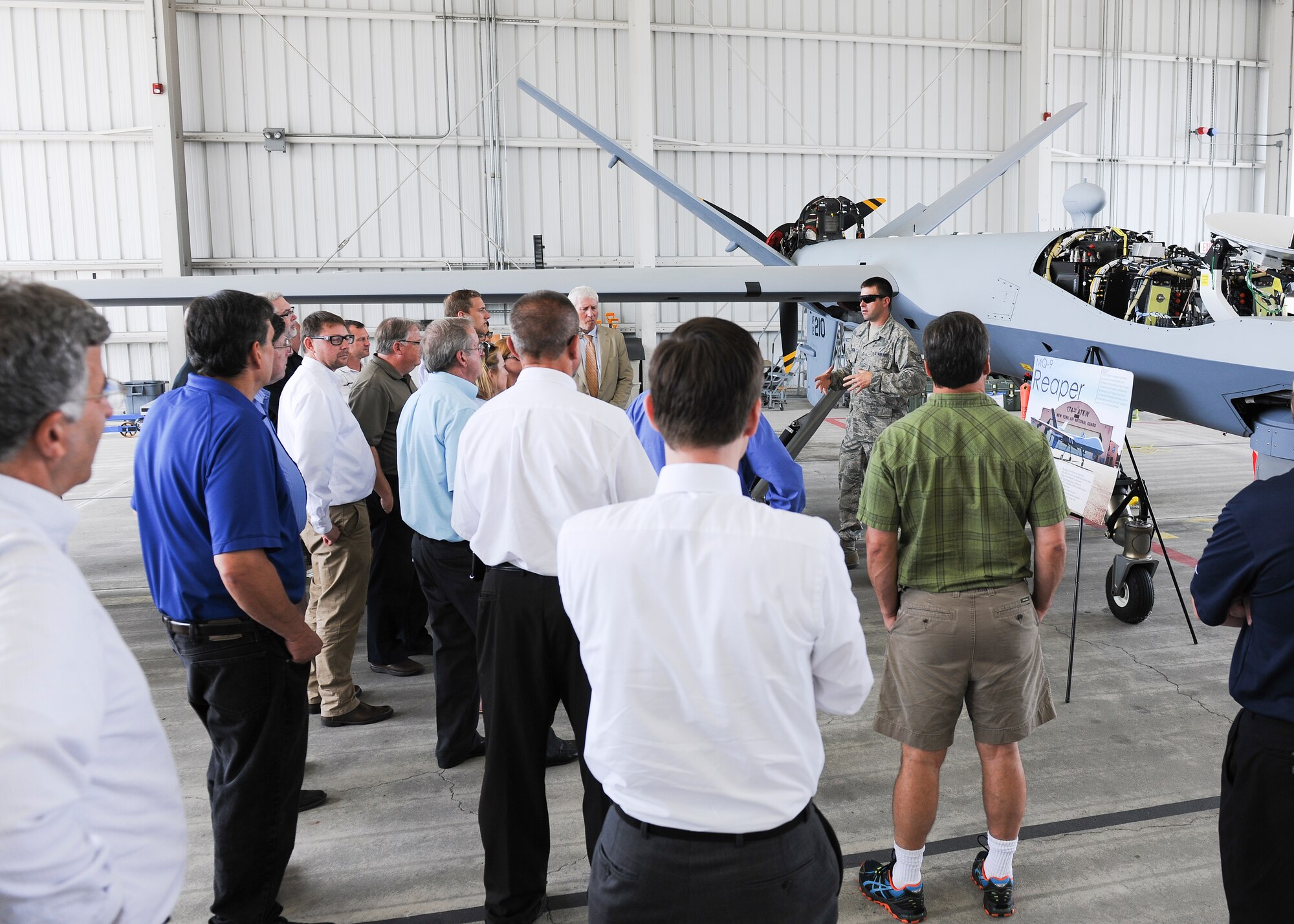 Local employers receive a briefing on the MQ-9 Remotely Piloted Aircraft, during an Employer Support of the Guard and Reserve (ESGR) Boss Day event on Hancock Field, Thursday, August 18. ESGR is a Department of Defense program established in 1972 to encourage cooperation between Reserve Component Service members and their employers. Boss Day events allow employers to see what their employees take part in as part of their military commitment. (U.S. Air National Guard photo by Tech. Sgt. Jeremy M. Call/Released)