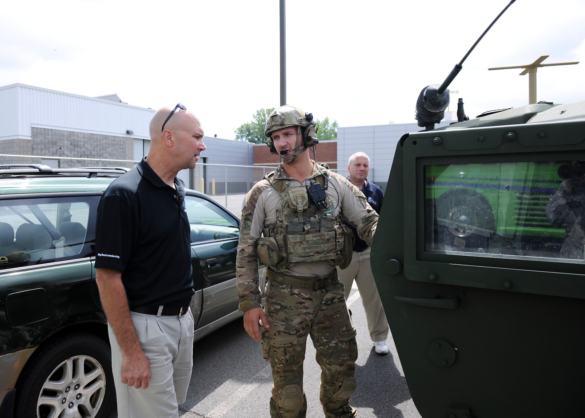 An Airmen with the 274th Air Support Operations Squadron (ASOS) is briefing local employers on the equipment that they utilize, as part of a Boss Day event hosted by the Employer Support of the Guard and Reserve (ESGR) on Hancock Field, Thursday, August 18. ESGR is a Department of Defense program established in 1972 to encourage cooperation between Reserve Component Service members and their employers. ESGR events like the Boss Day allow employers to see what their employees take part in as part of their military commitment. (U.S. Air National Guard photo by Tech. Sgt. Jeremy M. Call/Released)