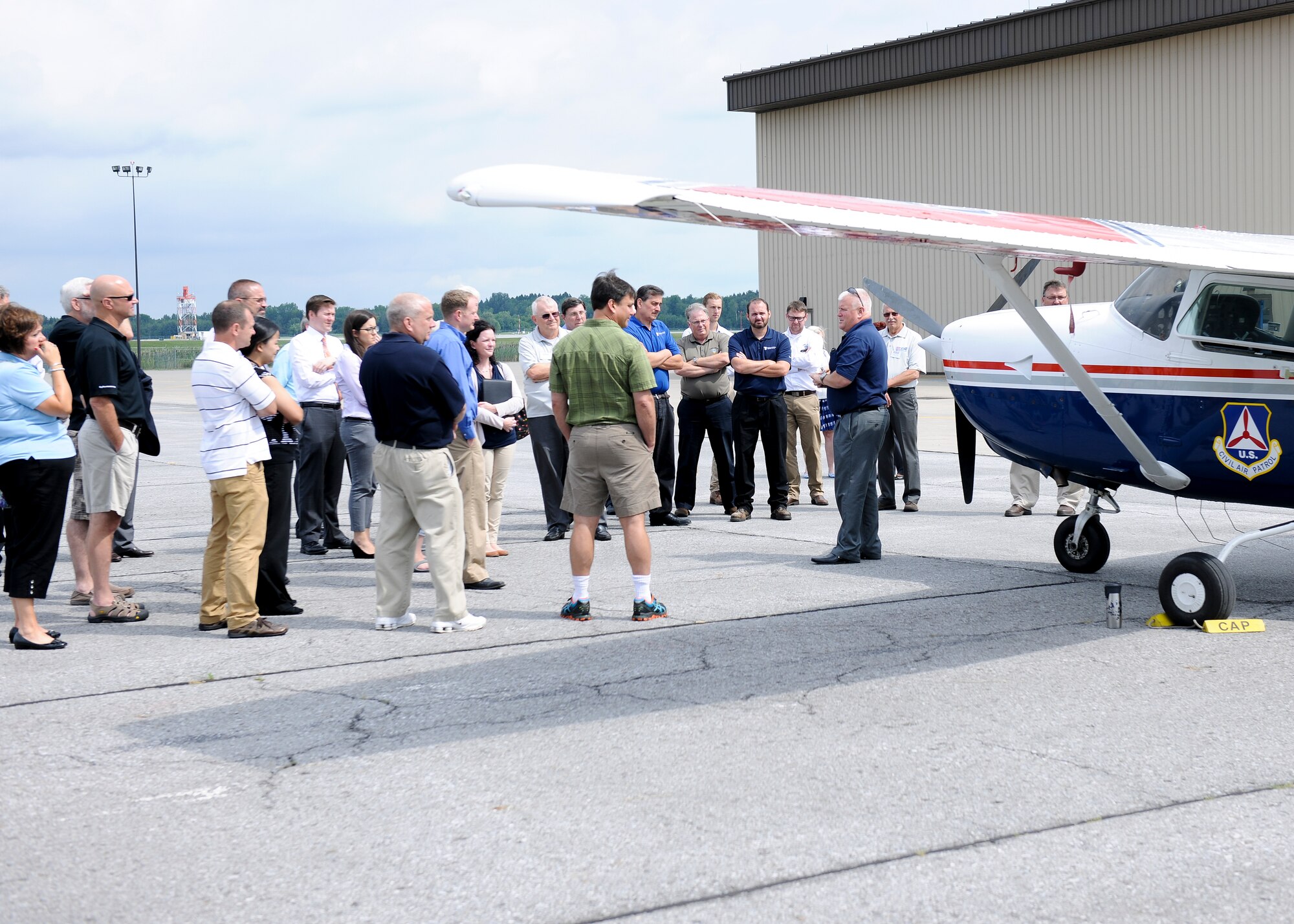 Local employers receive a briefing on the Civil Air Patrol, during an Employer Support of the Guard and Reserve (ESGR) Boss Day event on Hancock Field, Thursday, August 18. ESGR is a Department of Defense program established in 1972 to encourage cooperation between Reserve Component Service members and their employers. ESGR events like the Boss Day allow employers to see what their employees take part in as part of their military commitment. (U.S. Air National Guard photo by Tech. Sgt. Jeremy M. Call/Released)