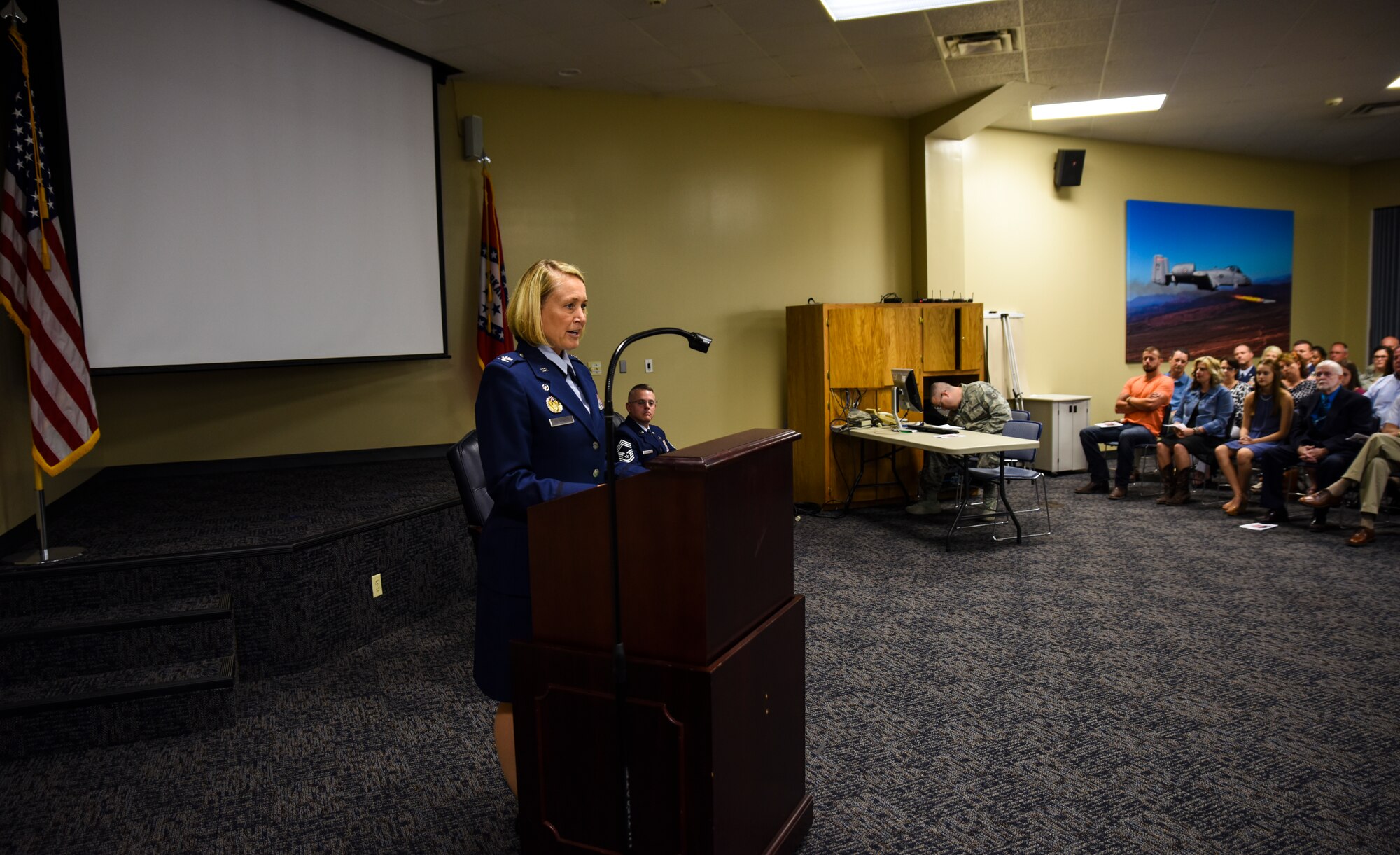 Col. Bobbi Doorenbos, 188th Wing commander, emphasizes the effect Chief Master Sgt. Bryan Peters had with the 188th Wing during his retirement ceremony Aug. 7, 2016, at Ebbing Air National Guard Base, Fort Smith, Ark. Peters, 188th Force Support Squadron supervisor, has served in the Air National Guard for over 24 years, all with the 188th Wing. (U.S. Air National Guard photo by Senior Airman Cody Martin)