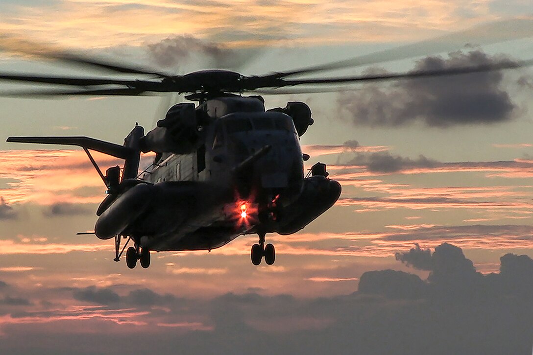 An MH-53E Sea Dragon approaches the flight deck of the USS Bonhomme Richard in the waters near Okinawa, Japan, Aug. 16, 2016. The amphibious assault ship is operating in the 7th Fleet area of operations to support security and stability in the Indo-Asia-Pacific region. The Sea Dragon is assigned to Helicopter Mine Countermeasure Squadron 14. Navy photo by Petty Officer 1st Class David Holmes