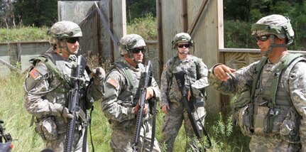 FORT MCCOY, Wis. --Cpl. Robert Achterberg, a water treatment specialist from the 651st Quartermaster Company out of Evansville, Wyo., briefs Army Reserve Soldiers prior to room clearance operations as part of the Combat Support Training Exercise here in Fort McCoy, Wis., on Aug. 16, 2016. CSTX immerses Army Reserve Soldiers and other service members in real-world  training scenarios to enhance unit readiness in the planning, preparation, and execution of combat service support operations. (U.S. Army Reserve photo by Spc. Christopher A. Hernandez, 345th Public Affairs Detachment)