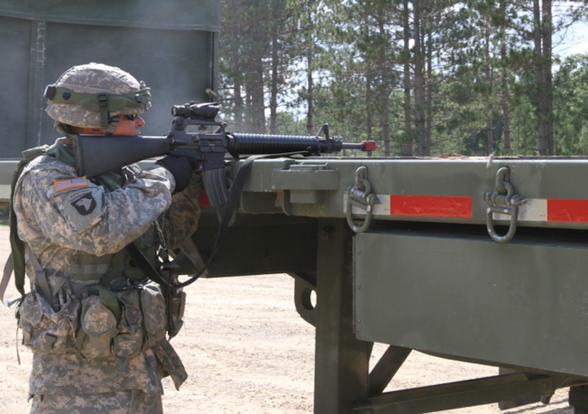 FORT MCCOY, WIs. -- Cpl. Robert Achterberg, a water treatment specialist from the 651st Quartermaster Company out of Evansville, Wyo., returns fire on enemy roleplayers during a base assault as part of the Combat Support Training Exercise here in Fort McCoy, Wis., on Aug. 16, 2016. CSTX immerses Army Reserve Soldiers and other service members in real-world  training scenarios to enhance unit readiness in the planning, preparation, and execution of combat service support operations. (U.S. Army Reserve photo by Spc. Christopher A. Hernandez, 345th Public Affairs Detachment)