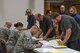 U.S. Airmen assigned to the 307th Medical Squadron review and update paperwork for Airmen assigned to the Individual Ready Reserves (IRR) during a Muster on Barksdale Air Force Base, La., Aug. 20, 2016. The annual IRR Muster provides IRR Airmen face to face briefings on member responsibilities as well as available Veteran’s benefits and career opportunities. (U.S. Air Force Photo by Master Sgt. Dachelle Melville/Released)
