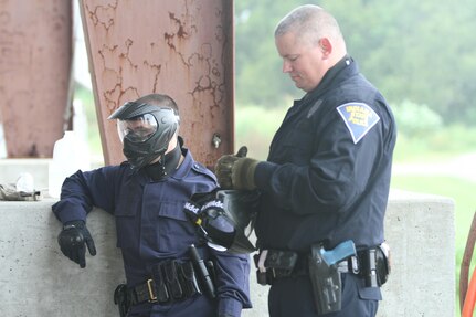 MUSCATATUCK URBAN TRAINING CENTER (MUTC) - Officers of the Indiana State Police gear up and and prepare for their training at Muscatatuck Urban Training Center on Aug. 16, 2016. The training took place for officers that wanted to hone their skills and better prepare themselves for the challenges they may encounter at any time. (U.S. Army Reserve photo by Spc. Eddie Serra, 205th Press Camp Headquarters)