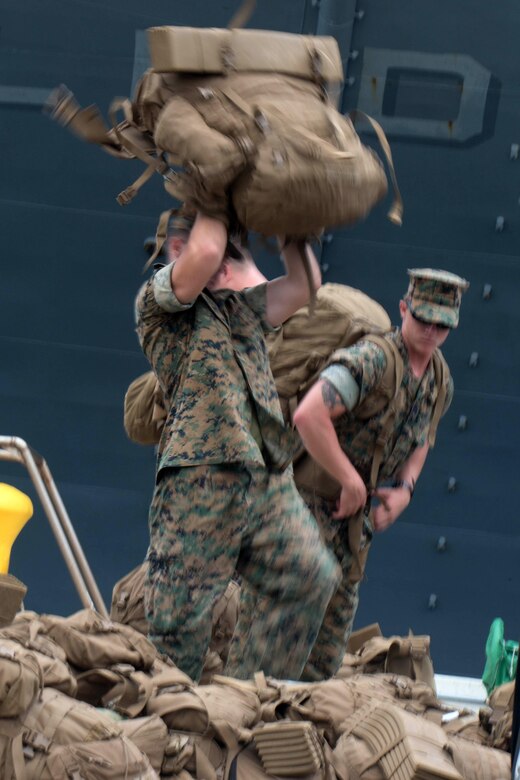 WHITE BEACH, Okinawa, Japan, (Aug. 20, 2016) – A Marine with the 31st Marine Expeditionary Unit, lifts his pack before going aboard the USS Bonhomme Richard (LHD-6), at White Beach, Okinawa, Japan, Aug. 20, 2016.
The 31st MEU is embarked aboard the ships of the Bonhomme Richard Amphibious Ready Group during a regularly scheduled patrol of the Pacific region. 