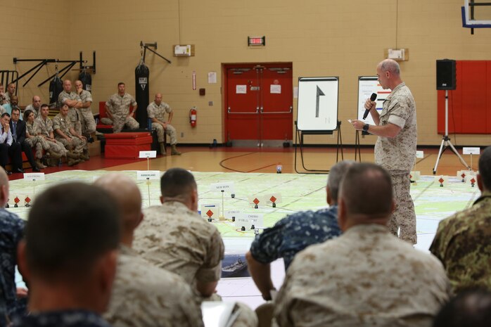 U.S. Marine Corps Major Bryan Hall briefing at the rehearsal of concepts drill during Bold Alligator 2016 at Camp Allen in Norfolk, Va., Aug. 13, 2016. BA16 focuses on improving Navy-Marine Corps amphibious core competencies along with coalition, North Atlantic Treaty Organization, Allied and partner nations as an investment in the current and future readiness of naval forces.