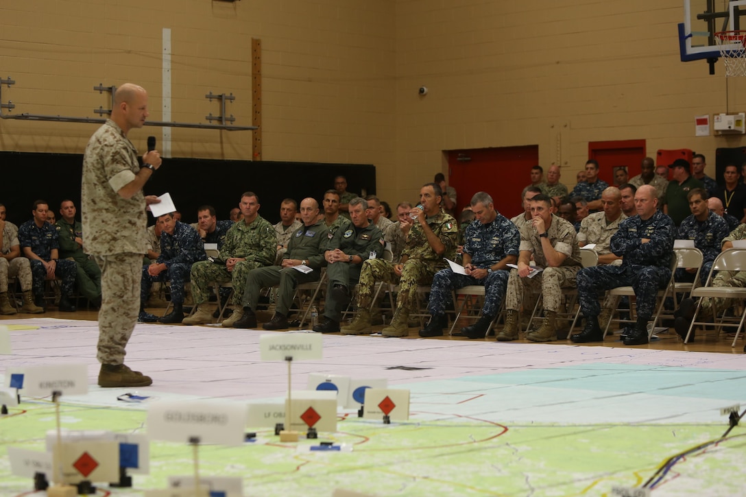 Flag Officers listen to a brief during the rehearsal of concepts drill during Bold Alligator 2016 at Camp Allen in Norfolk, Va., Aug. 13, 2016. BA16 focuses on improving Navy-Marine Corps amphibious core competencies along with coalition, North Atlantic Treaty Organization, Allied and partner nations as an investment in the current and future readiness of naval forces.