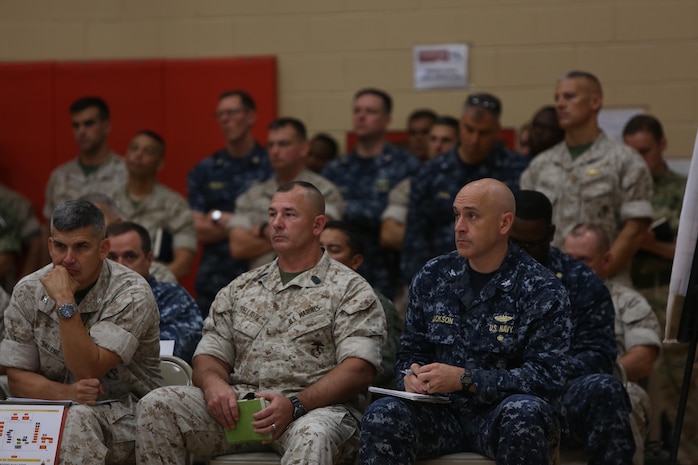 U.S. Marine Corps Col. Sean Salene, commanding officer, Marine Air Group 29, Sgt. Maj. John Elliot and U.S. Navy Capt. Jackson listen to the brief at the rehearsal of concepts drill during Bold Alligator 2016 at Camp Allen in Norfolk, Va., Aug. 13, 2016. BA16 focuses on improving Navy-Marine Corps amphibious core competencies along with coalition, North Atlantic Treaty Organization, Allied and partner nations as an investment in the current and future readiness of naval forces.