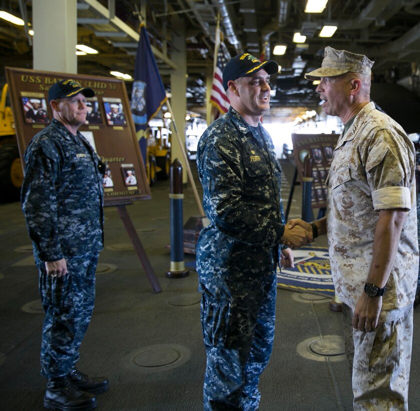 Commanding Officer, USS Bataan (LHD 5) Capt. Eric N. Pfister, left, greets Commander, U.S. Marine Corps Forces Command, Lt. Gen. John E. Wissler, aboard the amphibious assault ship USS Bataan (LHD 5). Bataan is participating in exercise Bold Alligator 2016, a multinational amphibious exercise practicing joint force entry operations in a contested environment as part of the larger series of exercises designed to increase amphibious capabilities among participating nations.