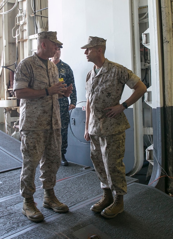 Commander, U.S. Marine Corps Forces Command Lt. Gen. John E. Wissler speaks with Commander, 2nd Marine Expeditionary Brigade Brig. Gen. Robert F. Castellvi during a visit aboard the amphibious assault ship USS Bataan (LHD 5). The 2d MEB is participating in exercise Bold Alligator 2016, a multinational amphibious exercise practicing joint forcible entry operations in a contested environment as part of the larger series of exercises designed to increase amphibious capabilities among participating nations.