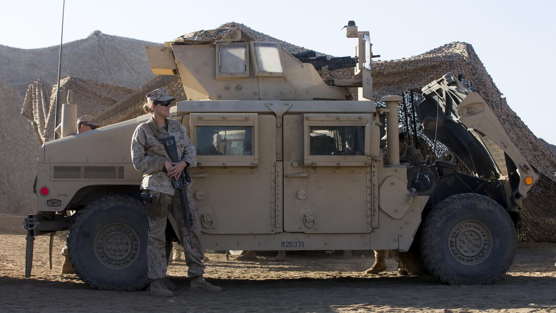 U.S. Marine Cpl. Victoria Demoss, Company A, Law Enforcement Battalion, I Marine Expeditionary Force Headquarters Group, stands in front of a Humvee as she waits to conduct training during I MEF Large Scale Exercise 2016 at Marine Corps Air Station Miramar, Calif., Aug. 17, 2016. LSE-16 is designed to enhance the command and control and interoperability between I MEF Command Element staff and its higher, adjacent and subordinate command headquarters. The exercise includes cyber and electronic warfare, information support operations, and simulated and live-fire events.