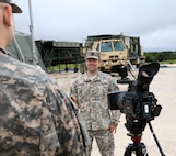 FORT HOOD, Texas – Spc. Logan Rath, an Army Reserve public affairs broadcaster, interviews Company Commander Capt. Andrew Graham, of the 340th Quartermaster Company on Aug. 16, 2016. Graham discusses the importance of Soldier accountability as it relates to garment handling. (U.S. Army Reserve photo by Sgt. Michael Adetula/Released)