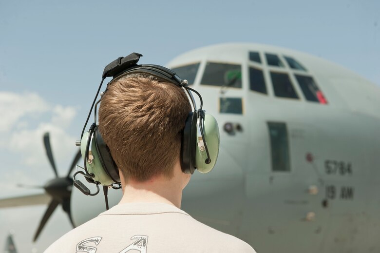 Senior Airman Austin Bryson, 774th Expeditionary Airlift Squadron C-130J Super Hercules loadmaster, communicates with pilots in the cockpit of a C-130J while
pre-flight checklists were completed, Bagram Airfield, Afghanistan, Aug. 19, 2016. Loadmasters assist pilots to ensure that the aircraft properly starts prior to flight operations beginning. (U.S. Air Force photo by Capt. Korey
Fratini)