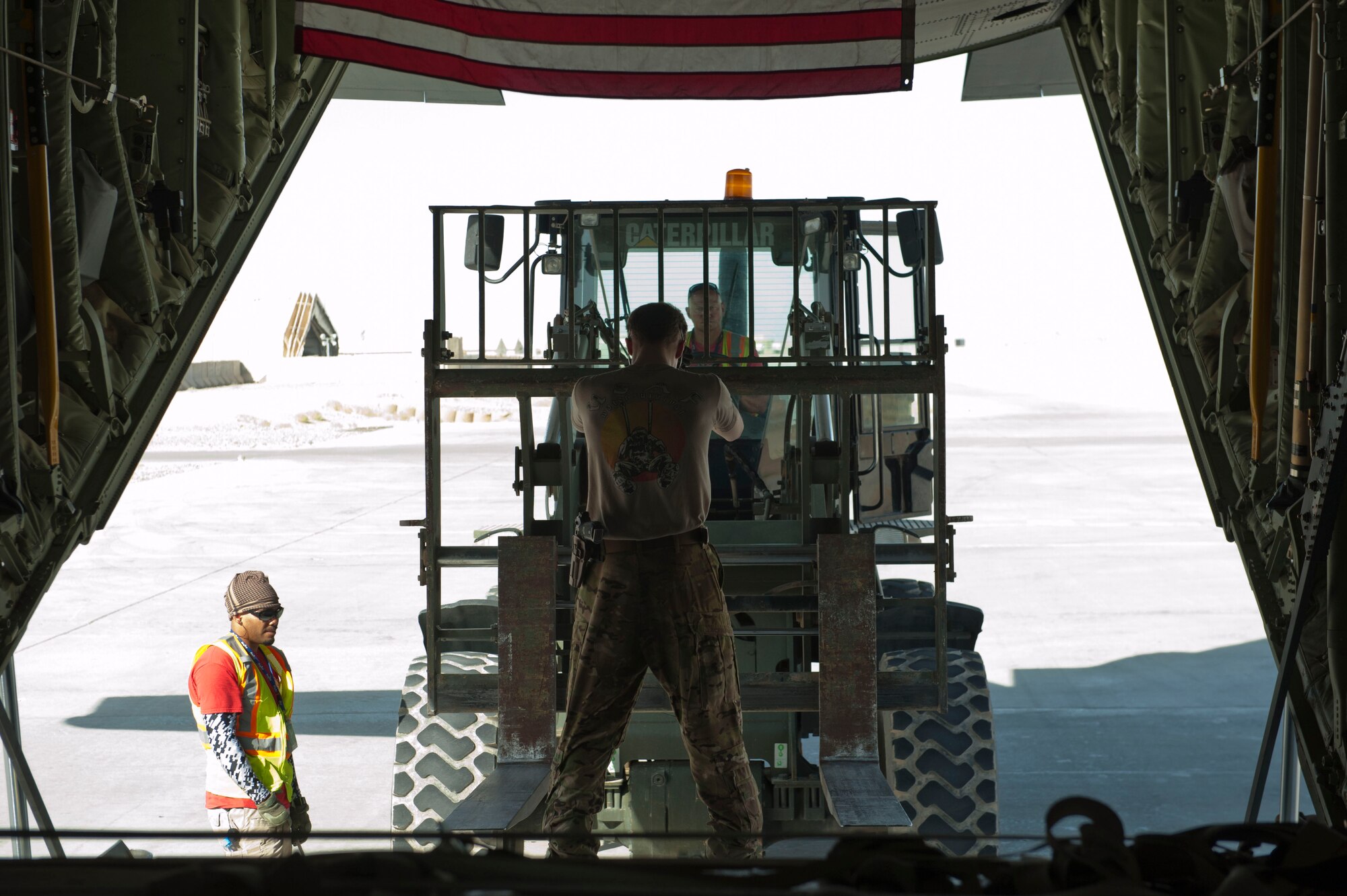 Senior Airmen Austin Bryson, 774th Expeditionary Airlift Squadron loadmaster signals to a forklift operator to stop as the C-130J Super Hercules aircrew prepares to offload a pallet of cargo Camp Dywer, Afghanistan, Aug. 19, 2016.
The C-130J Super Hercules is one of the primary aircraft used to deliver cargo and other assets from the aerial port at Bagram Airfield, Afghanistan to other bases throughout the country. (U.S. Air Force photo by Capt. Korey Fratini)