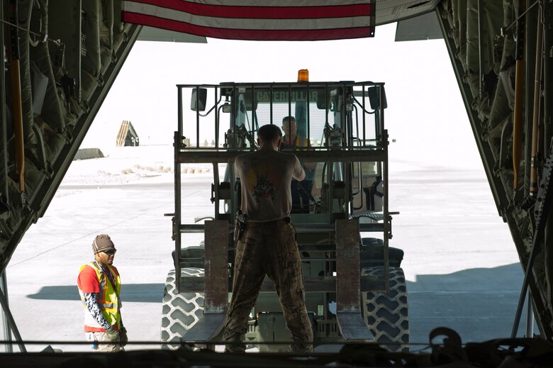 Senior Airmen Austin Bryson, 774th Expeditionary Airlift Squadron loadmaster signals to a forklift operator to stop as the C-130J Super Hercules aircrew prepares to offload a pallet of cargo Camp Dywer, Afghanistan, Aug. 19, 2016.
The C-130J Super Hercules is one of the primary aircraft used to deliver cargo and other assets from the aerial port at Bagram Airfield, Afghanistan to other bases throughout the country. (U.S. Air Force photo by Capt. Korey Fratini)