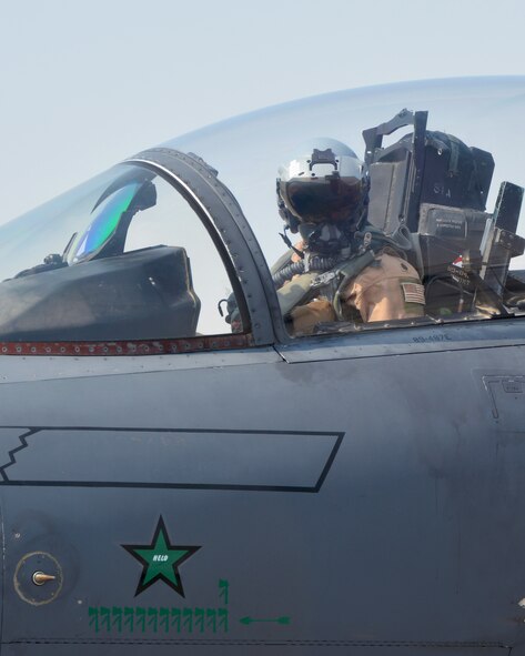 Lt. Col. Brandon, 335th Expeditionary Fighter Squadron commander, pilots F-15E Strike Eagle #89-0487 as it taxis back from its 12,000 flying hour milestone flight at an undisclosed location, Aug. 16, 2016. Brandon also achieved a career milestone during the same flight, attaining 3,000 flying hours after 25 years of service. (U.S. Air Force photo by Staff Sgt. Samantha Mathison)