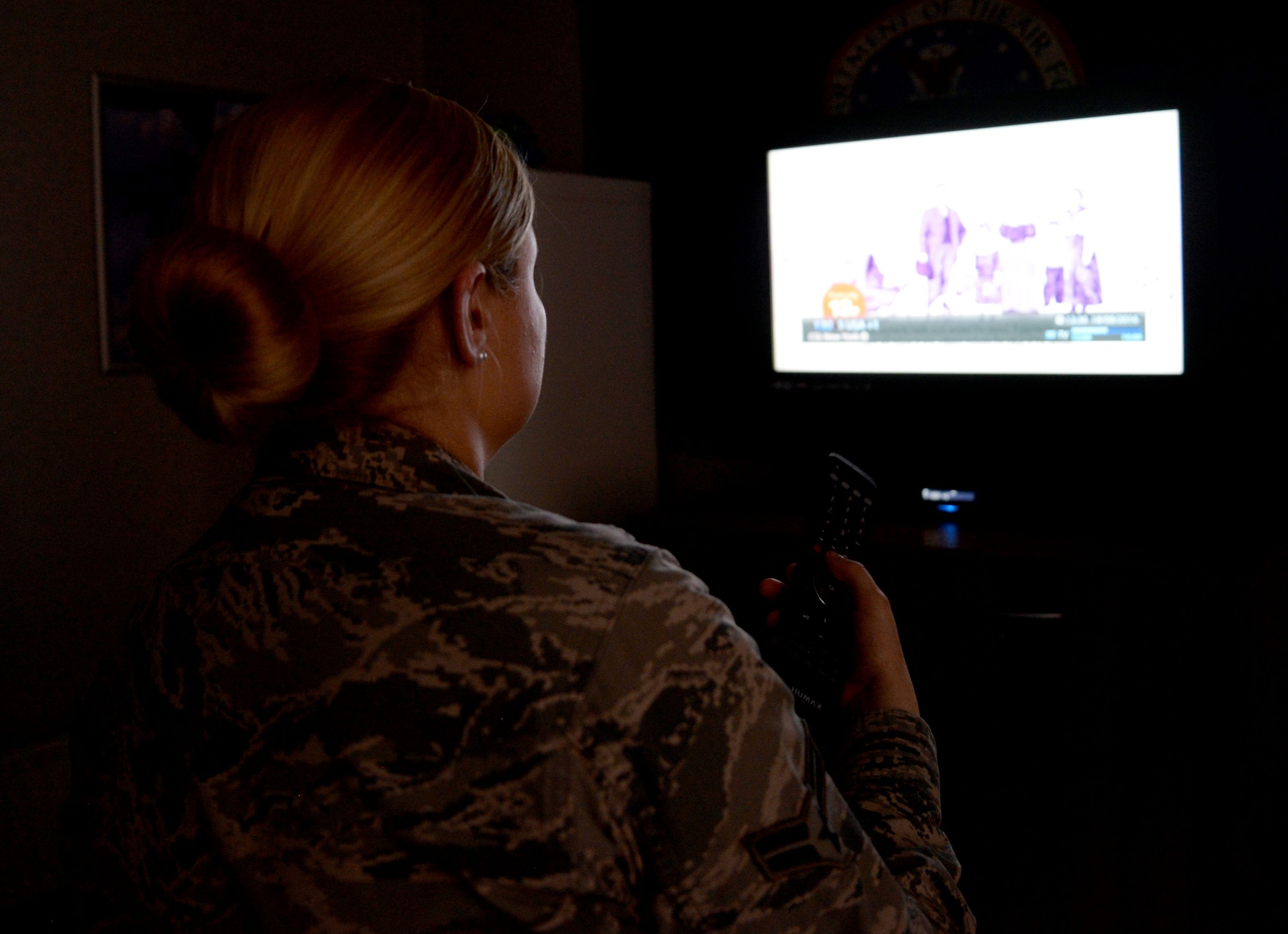 A U.S. Air Force Airman watches television at her leisure on RAF Mildenhall, England. Off-base military members in the U.K are required to purchase a TV License if they watch or record live TV at home on any device to include laptops or tablets. While some military members do not own a television, the law includes online websites, apps or smart TV services. (U.S. Air Force photo by Senior Airman Justine Rho)
