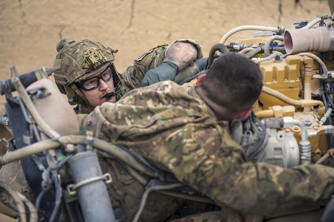 Air Force Senior Airman Austin Henson, left, provides aid to Senior Airman Russell Prisinki during a joint mass casualty and extraction exercise at Bagram Airfield, Afghanistan, Aug. 18, 2016. Henson is a pararescueman assigned to the 83rd Expeditionary Rescue Squadron. Prisinki is a Squadron traffic management journeyman assigned to the 455th Expeditionary Maintenance Squadron. Air Force photo by Senior Airman Justyn M. Freeman 