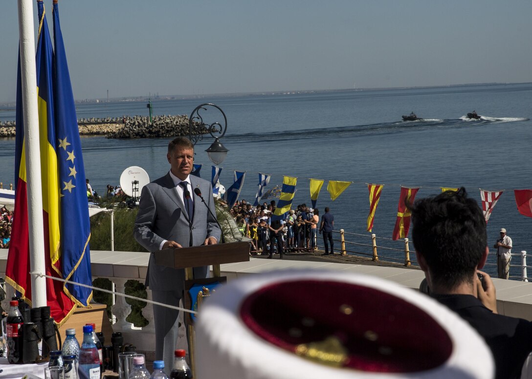 Klaus Iohannia, president of Romania, welcomes guests and U.S. Sailors and Marines supporting the Black Sea Rotational Force 16.2 to the 114th annual Navy Day celebration at the Port of Constanţa, Romania, Aug. 15, 2016. The day payed tribute to the prestigious history of the Romanian navy and highlighted the military’s movement toward new developments and modernizations. Black Sea Rotational Force is an annual multilateral security cooperation activity between the U.S. Marine Corps and partner nations in the Black Sea, Balkan and Caucasus regions designed to enhance participants’ collective professional military capacity, promote regional stability and build enduring relationships with partner nations. (U.S. Marine Corps photo by Sgt. Michelle Reif)