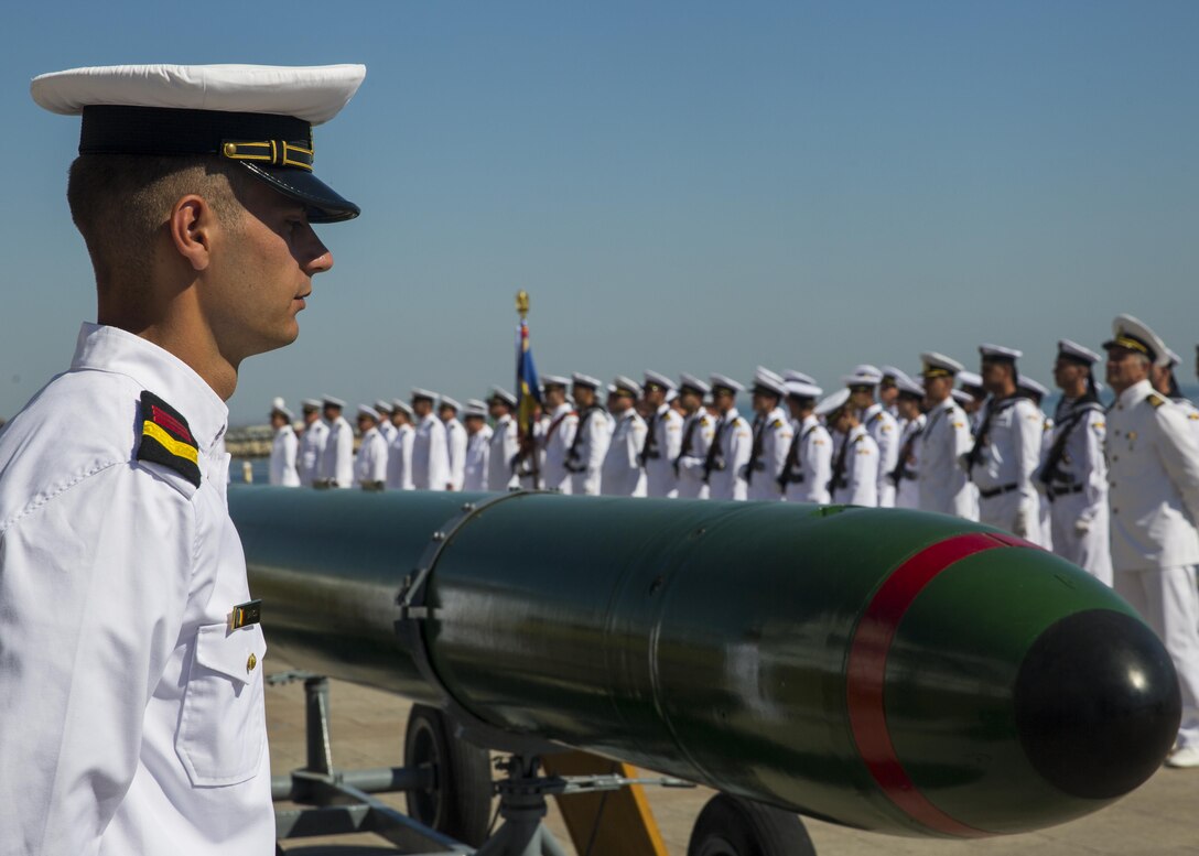 A Romanian sailor stands in front of his platoon during the opening ceremony of the 114th annual Navy Day celebration at the Port of Constanţa, Romania, Aug. 15, 2016. U.S. Sailors and Marines supporting the Black Sea Rotational Force 16.2 helped pay tribute to the prestigious history of the Romanian navy and highlighted the military’s movement toward new developments and modernizations. Black Sea Rotational Force is an annual multilateral security cooperation activity between the U.S. Marine Corps and partner nations in the Black Sea, Balkan and Caucasus regions designed to enhance participants’ collective professional military capacity, promote regional stability and build enduring relationships with partner nations. (U.S. Marine Corps photo by Sgt. Michelle Reif)