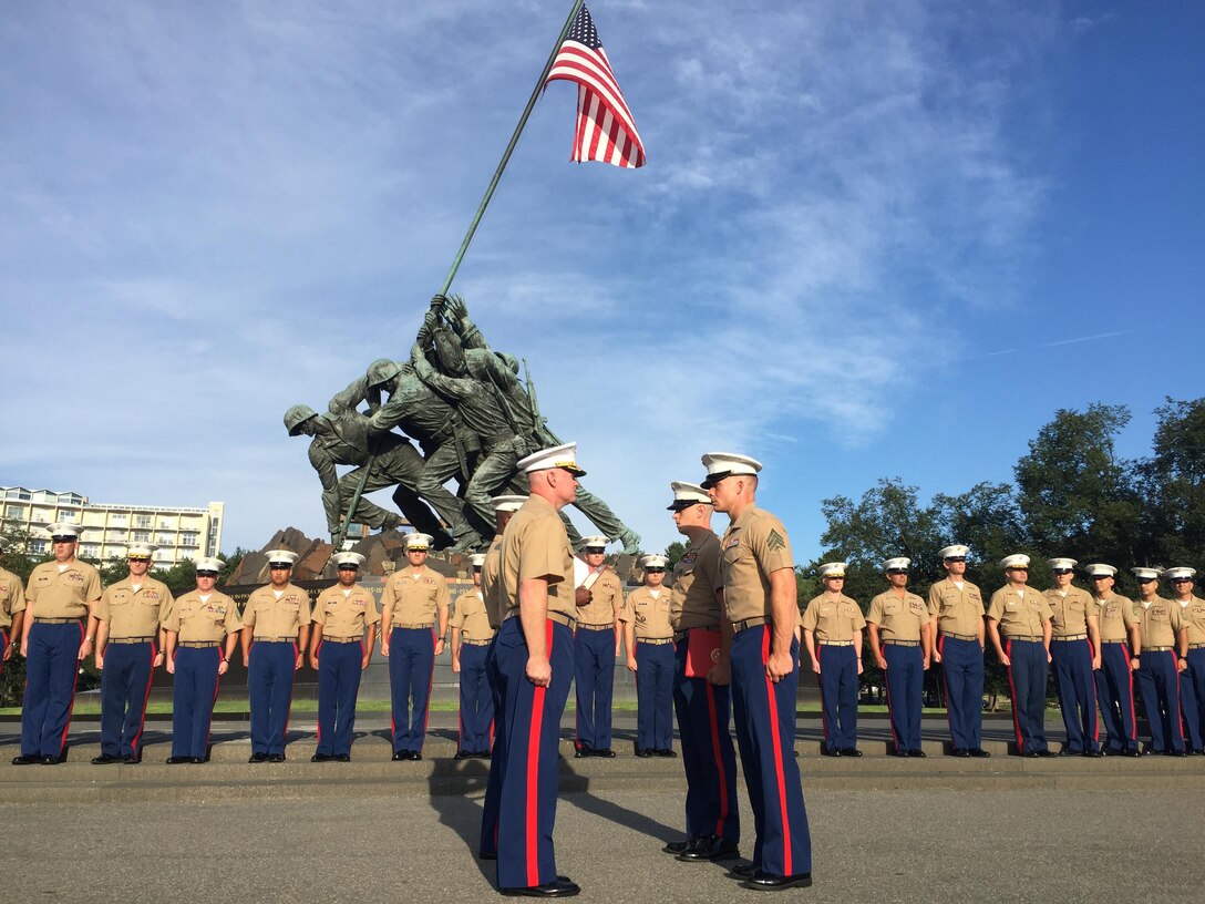 Sergeant Jacob Grose and Staff Sgt Dante Capane are awarded the Navy and Marine Corps Achievement Medal at the Marine Corps War Memorial, 19 Aug. for outstanding performance during Marine Corps Recruiting Command's spring offensive 'Sustaining the Force.' Grose was the overall top recruiter and Capane was the overall top staff non commissioned officer in charge. Grose and Capane are currently serving at RSS Three Rivers, RS PIT. 
