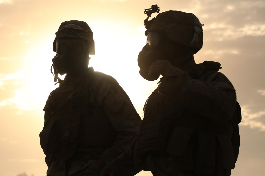 Marines with 1st Battalion, 1st Marine Regiment, stand on the firing line after a live fire range August 18, 2016, at Bradshaw Field Training Area, Northern Territory, Australia. The range was the final training evolution of Exercise Koolendong 16, a trilateral exercise between the U.S. Marine Corps, Australian Defence Force and French Armed Forces New Caledonia. Marines held a defensive position while engaging targets and working through the CS gas, which simulated a chemical attack. (U.S. Marine Corps photo by Sgt. Sarah Anderson)
