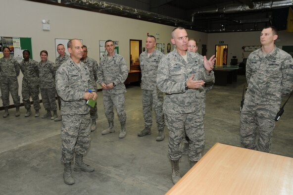 Col. William Phillips, right, 386th Expeditionary Maintenance Group commander, briefs Lt. Gen. Jeffrey Harrigian, U.S. Air Forces Central Command commander, about their mission and accomplishments Aug. 21, 2016, at an undisclosed location in Southwest Asia. Harrigian made his first visit to the base after taking command of AFCENT last month. (U.S. Air Force photo/Senior Airman Zachary Kee)