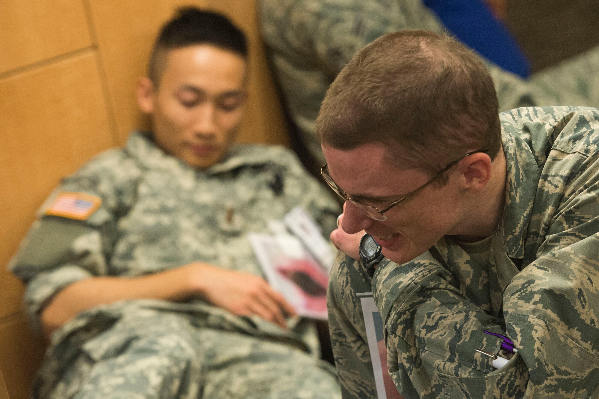 U.S. Air Force 2nd Lt.  Joshua Cummock, and U.S. Army 2nd Lt. Wesley Sit, participate in an active shooter exercise on Wright-Patterson Air Force Base, Ohio, August 4, 2016. Readiness exercises are routinely held to streamline unit cohesion when responding to emergencies. (U.S. Air Force photo / Wesley Farnsworth)