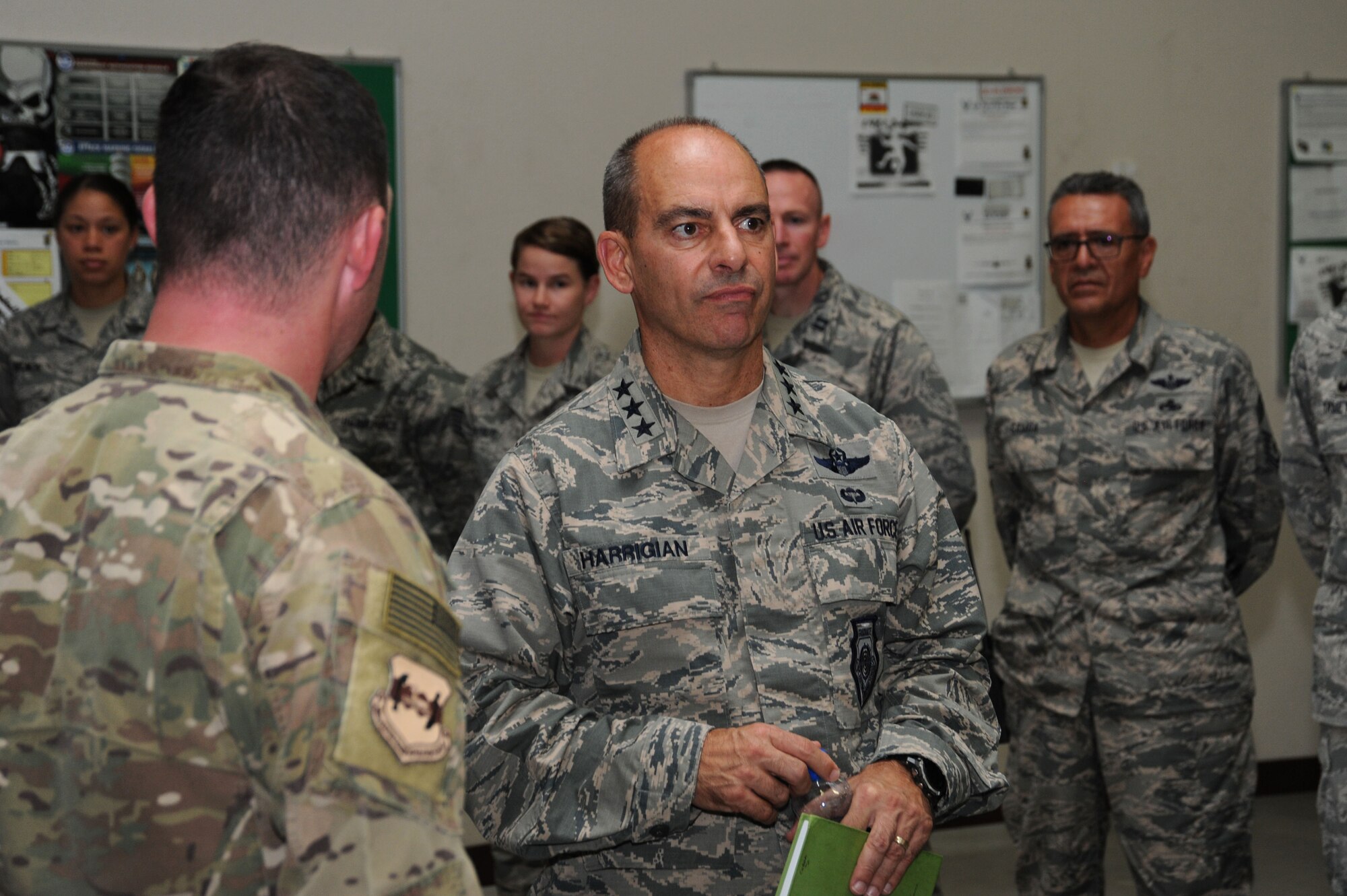 Lt. Gen. Jeffrey Harrigian, U.S. Air Forces Central Command commander, is briefed by Lt. Col. Corey Reed, 386th Expeditionary Operations Group deputy commander, Aug. 21, 2016, at an undisclosed location in Southwest Asia. Harrigian made his first visit to the base after taking command of AFCENT last month. (U.S. Air Force photo/Senior Airman Zachary Kee)