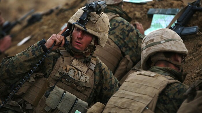 A Marine with 1st Battalion, 1st Marine Regiment, talks over the radio during a live fire range August 18, 2016 at Bradshaw Field Training Area, Northern Territory, Australia. The range was the final training evolution of Exercise Koolendong 16, a trilateral exercise between the U.S. Marine Corps, Australian Defence Force and French Armed Forces New Caledonia.