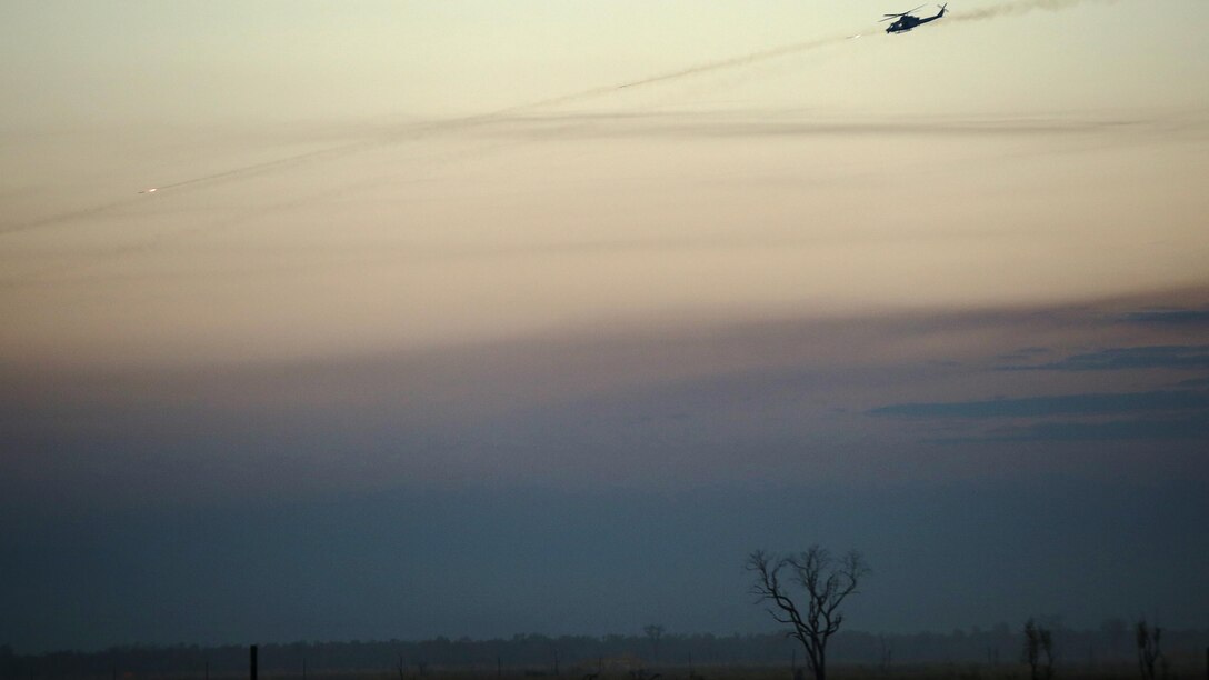 A UH-1Y Venom helicopter with Marine Light Attack Helicopter Squadron 367 provides close air support for Marines on the ground during a live fire range August 18, 2016 at Bradshaw Field Training Area, Northern Territory, Australia. The range was the final training evolution of Exercise Koolendong 16, a trilateral exercise between the U.S. Marine Corps, Australian Defence Force and French Armed Forces New Caledonia.