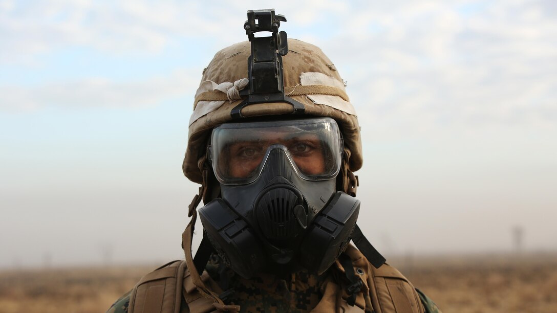 Lance Cpl. Bradley J. Hubbard, a chemical biological riadiocative defense specalist with 1st Battalion, 1st Marine Regiment, stands on the firing line after a live fire range August 18, 2016, at Bradshaw Field Training Area, Northern Territory, Australia. The range was the final training evolution of Exercise Koolendong 16, a trilateral exercise between the U.S. Marine Corps, Australian Defence Force and French Armed Forces New Caledonia. Marines held a defensive position while engaging targets and working through the CS gas, which simulated a chemical attack.