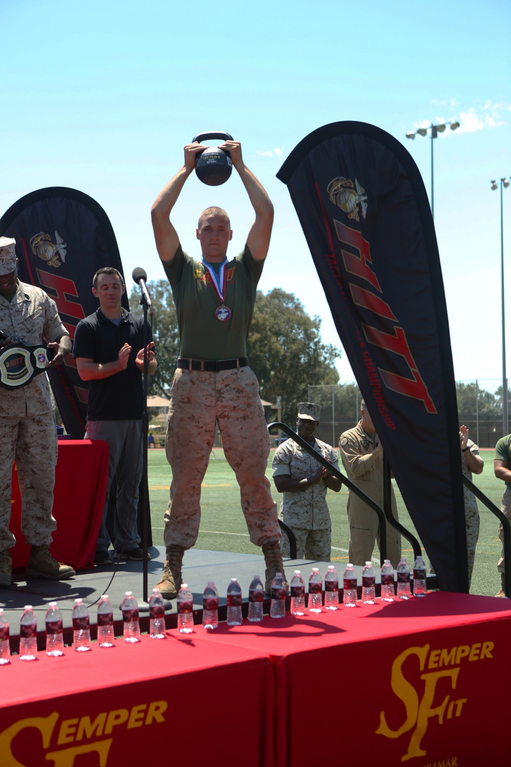 Cpl. Ethan Mawhinney, the top male competitor of the Tactical Athlete Championship, holds his trophy up during an awards ceremony aboard Marine Corps Air Station Miramar, Calif., Aug. 18. The competition was a part of the Marine Corps’ High Intensity Tactical Training program and tested the strengths and abilities of Marines from different installations around the Corps. (U.S. Marine Corps photo by Pfc. Liah Kitchen/Released) 