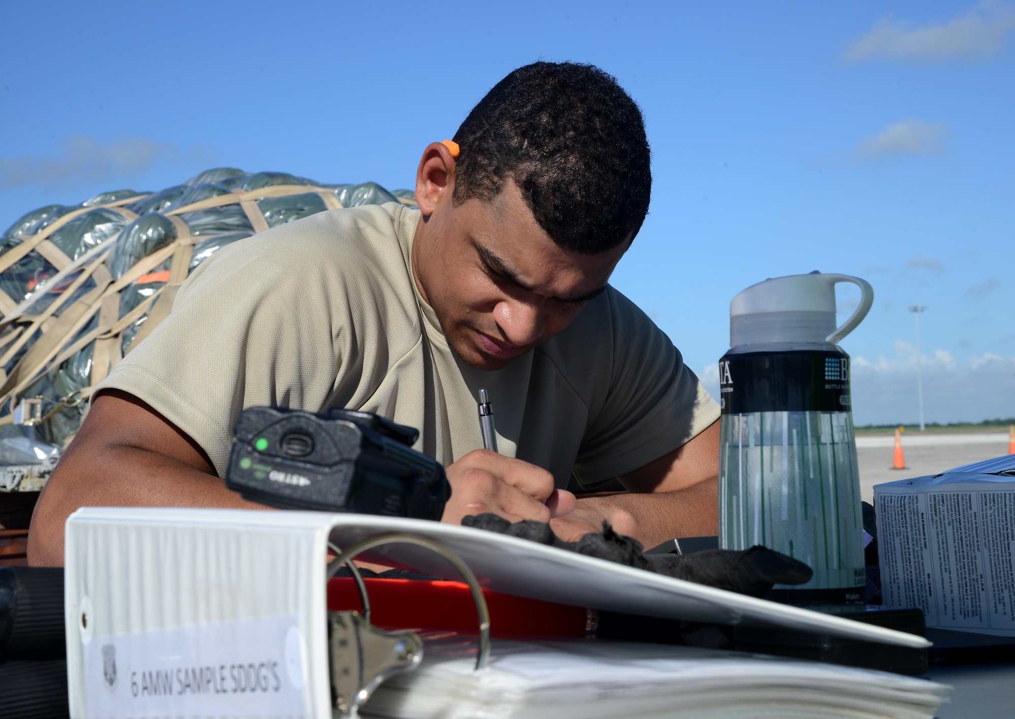 Airman 1st Class Andrew Small, a fleet management analysis technician assigned to the 6th Logistics Readiness Squadron, completes a cargo placard during a mobility exercise at MacDill Air Force Base, Fla., Aug. 16, 2016. Each individual piece of cargo is required to have a placard on it listing the contents and weight of the equipment to maintain accurate records. (U.S. Air Force Photo by Airman 1st Class Rito Smith) 