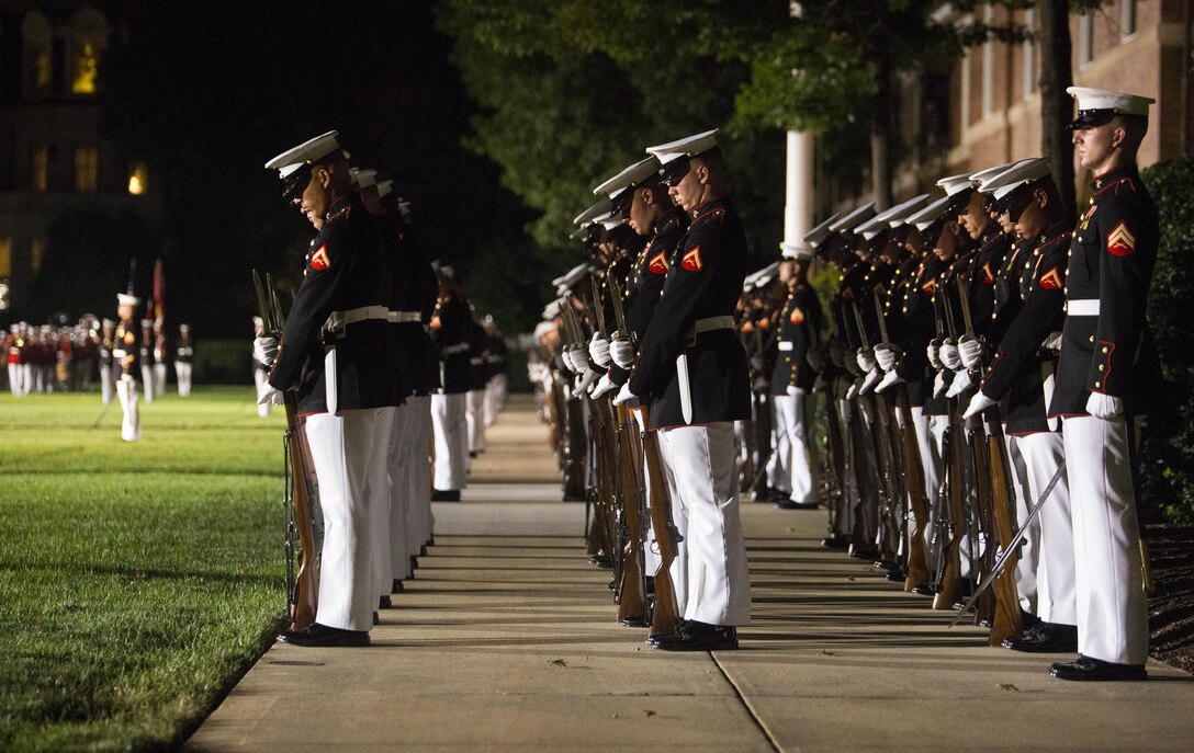 Marines of Marine Barracks Washington, D.C., execute the command "fix bayonets" during the Noncommissioned Officer's Parade at Marine Barracks, Washington, D.C., Aug. 19, 2016. The guest of honor for the parade was Adm. John M. Richardson, chief of Naval Operations and the hosting official was Gen. Robert B. Neller, commandant of the Marine Corps. (Official Marine Corps photo by Lance Cpl. Robert Knapp/Released)