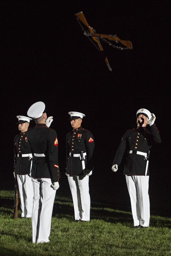 The United States Marine Corps Silent Drill Platoon performs during the Noncommissioned Officer's Parade at Marine Barracks Washington, D.C., Aug. 19, 2016. The guest of honor for the parade was Adm. John M. Richardson, chief of Naval Operations and the hosting official was Gen. Robert B. Neller, commandant of the Marine Corps. (Official Marine Corps photo by Lance Cpl. Robert Knapp/Released)